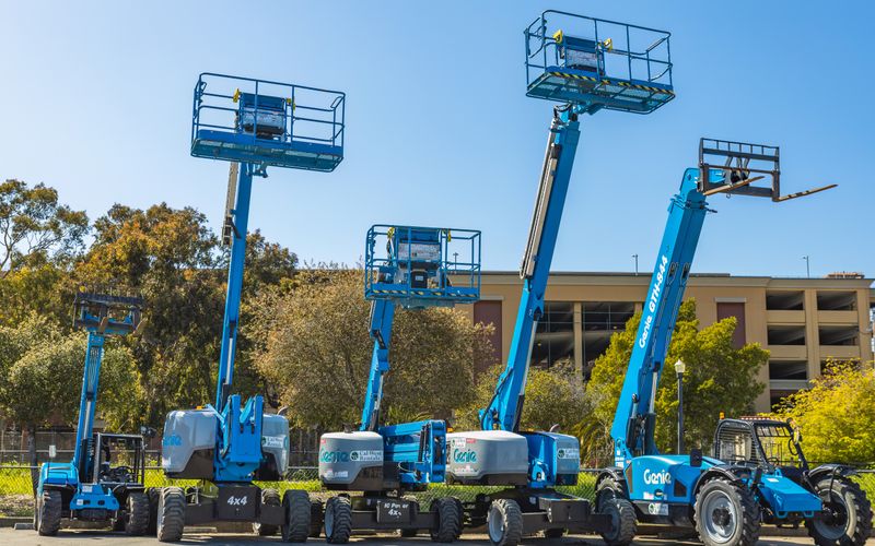 Aerial lift and forklift equipment at an industrial site